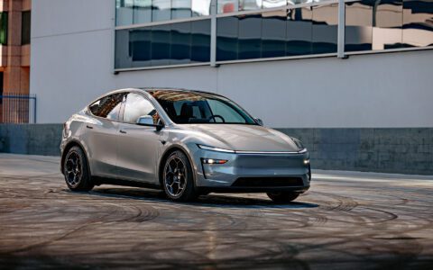 A front three quarter shot of a 2026 Tesla Model Y Launch Edition with Satin Black 19 inch UP-05 Forged Wheels parked.