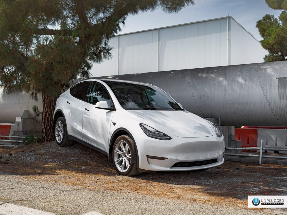 Pearl White Multi-Coat Tesla Model Y – Unplugged Performance Dirt & Snow Suspension Upgrade