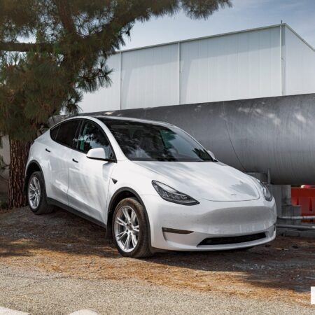 Pearl White Multi-Coat Tesla Model Y – Unplugged Performance Dirt & Snow Suspension Upgrade