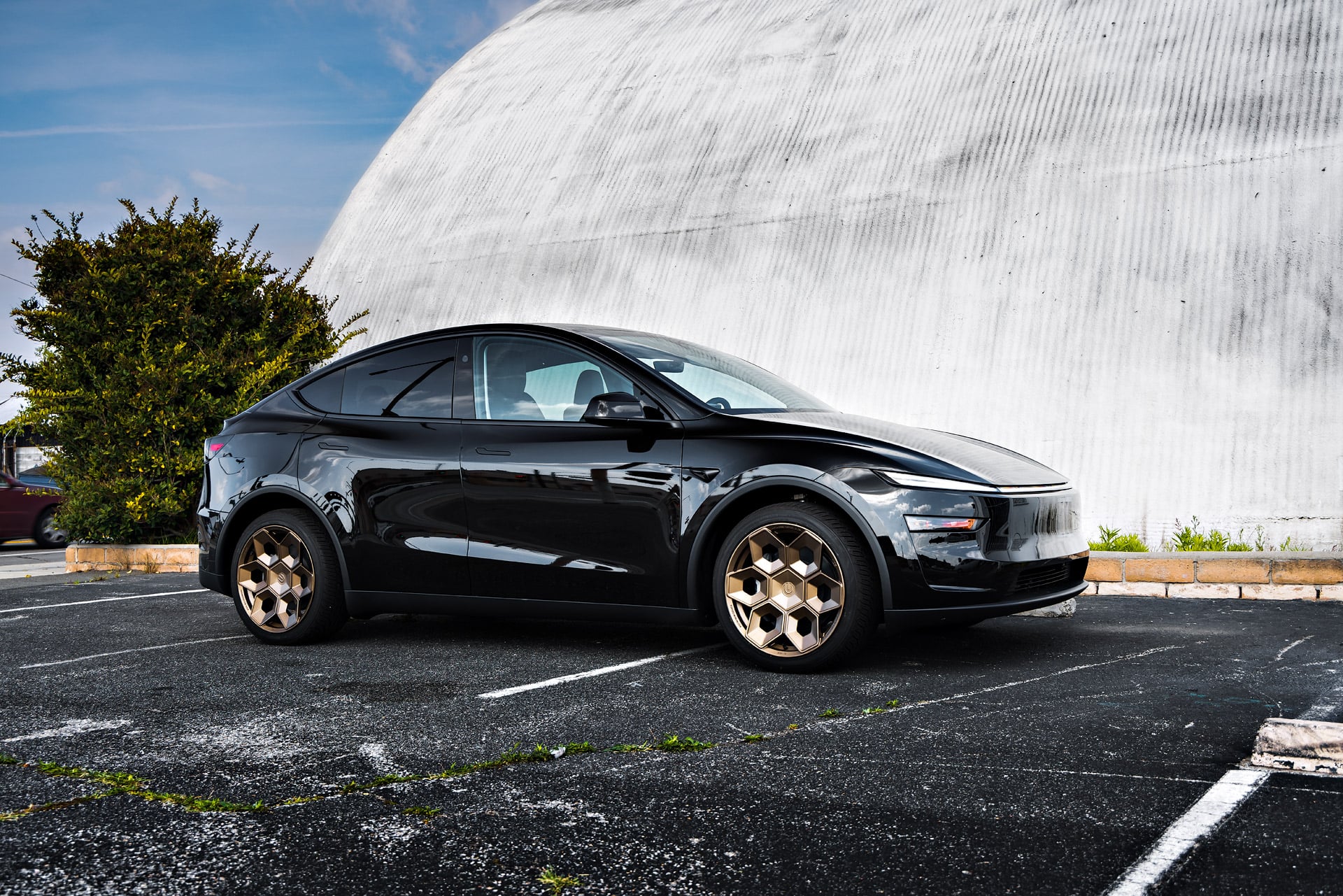 Diamond Black Tesla Model Y Juniper on CYBRHEX Forged Wheels in Satin Bronze