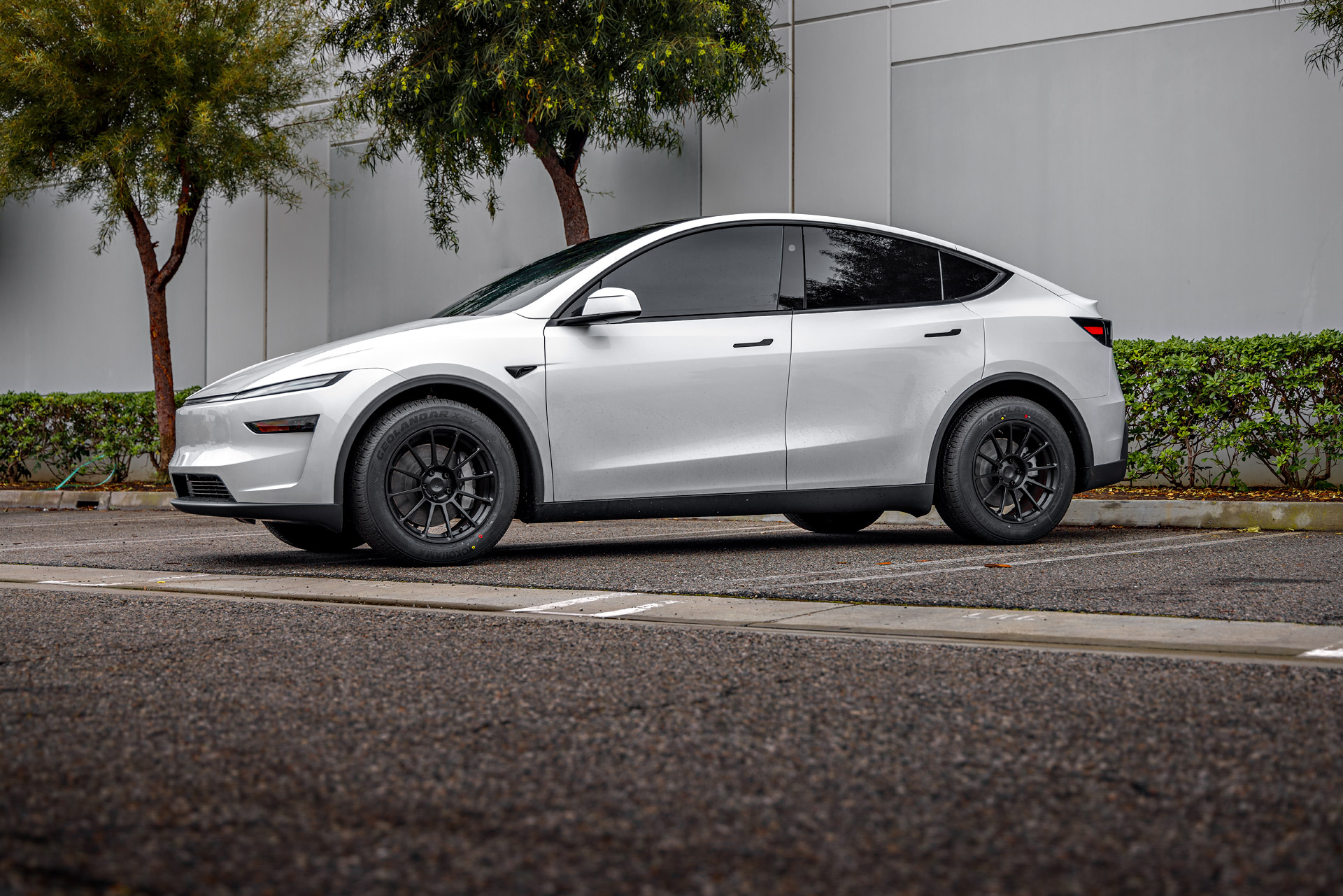2026 Pearl White Model Y Juniper on 18 inch Off-Road Spec UP-03 in Satin Black